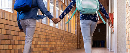 Students Holding Hands Hallway